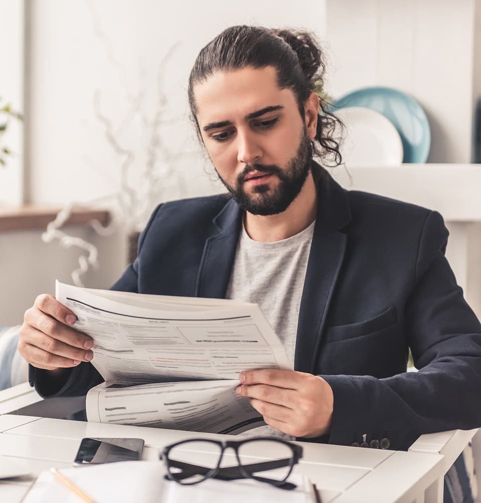 Italian man looking at tax documents